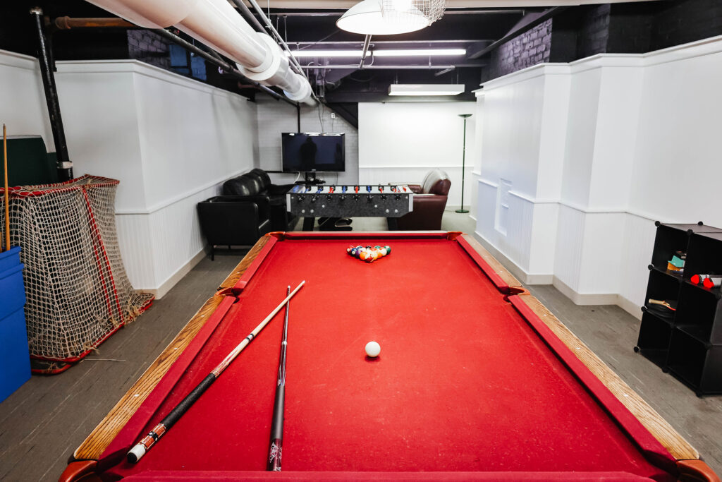 game room with red pool table